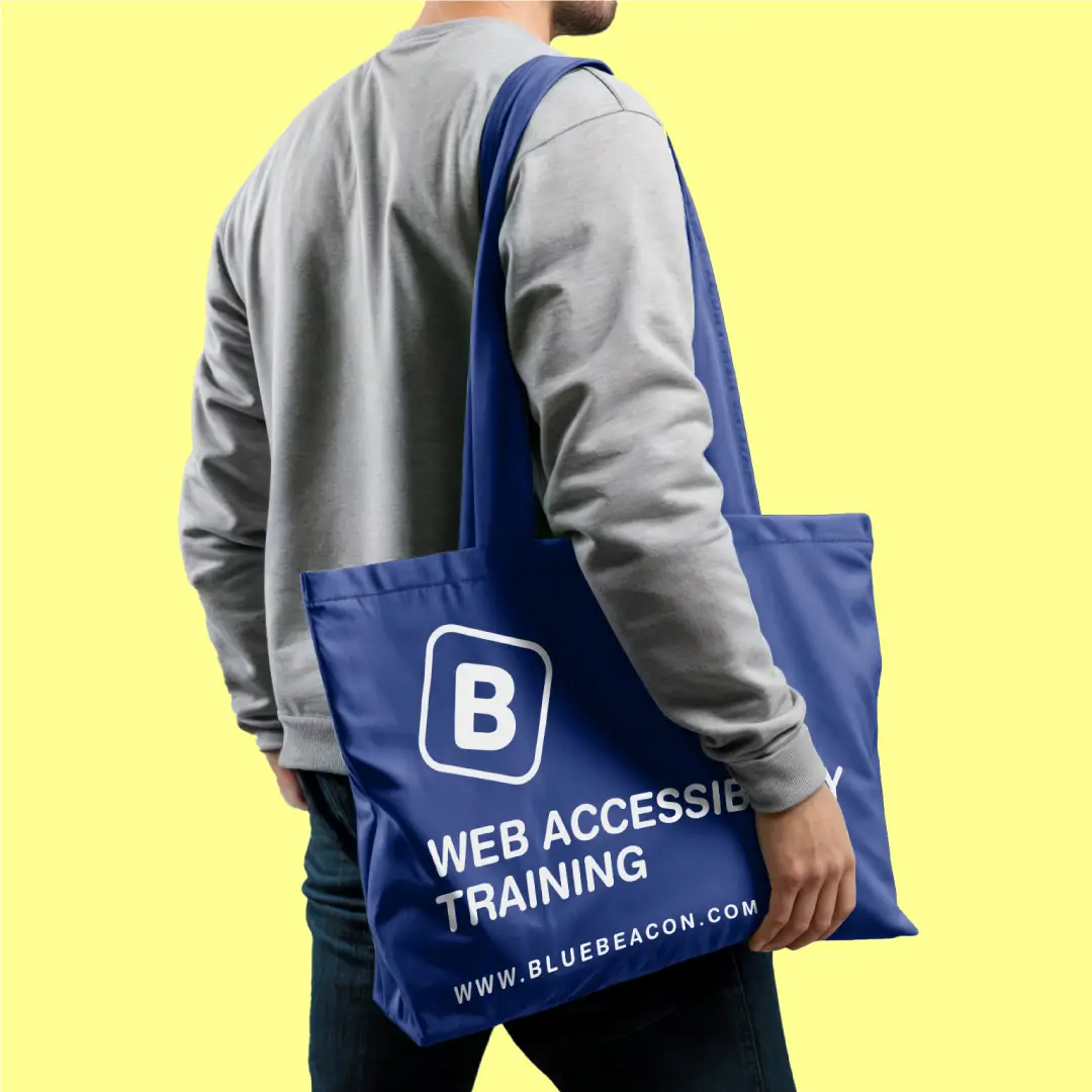 A navy tote bag featuring the Blue Beacon logo and branding, designed for promotional use.